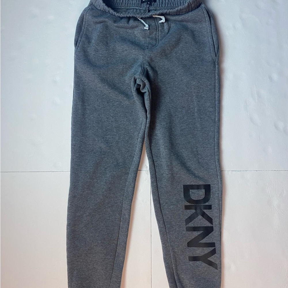 Kids size 10-12M joggers by DKNY color dark grey.